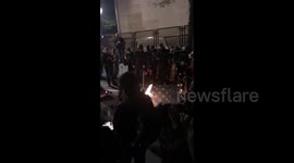 People scream and play musical instruments on protest in Portland