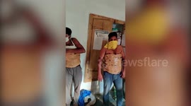 Two men arrested for smuggling liquor strapped to their body in India