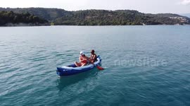 Young couple kayaking on Lac de Sainte-Croix, Gorges Du Verdon, France