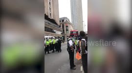 Police on the scene as Extinction Rebellion cause traffic jam in central London