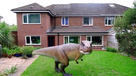 Wacky husband shocked his wife who told him to liven up their back garden with a gnome – by installing a 12ft tall replica of a T-REX