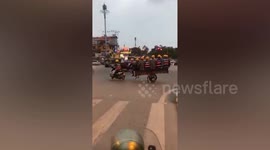 Vietnamese workers cram into tiny cart