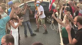 Protesters carry burning torches and nooses in Beirut anti-government demonstration