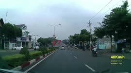 Mini smashes into central island on road in Vietnam