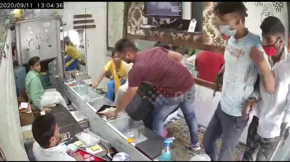 Bizarre moment armed robbers use hand sanitiser before snatching jewellery