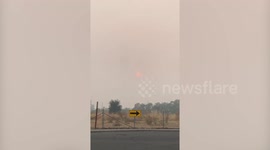 Sun sets through smoke of California wildfires