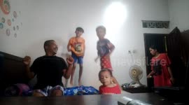 jump on the bed with the child make happyness each  others dad with kids