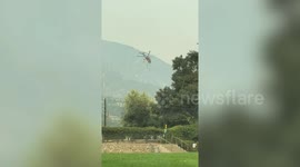 Helicopter collects water to fight Bobcat Fire in California