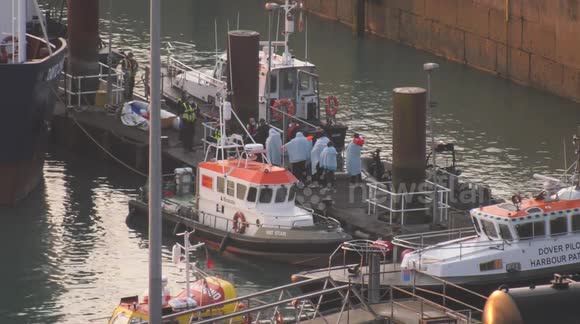Migrants crossing English Channel brought ashore by UK Border Force