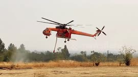 Sikorsky S-64 Skycrane refills its water tank at a nearby reservoir while fighting the Bobcat Fire in Sierra Madre, California