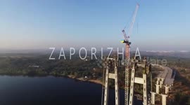 This is the moment a daredevil teenager makes the perilous climb of an abandoned Crane and is even pictured dangling 600ft above the ground.