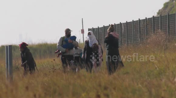 Migrants including children arrive on Kent beach in southeast England
