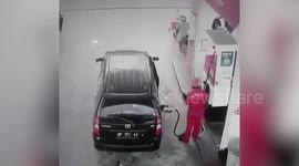 Car bursts into flames while being re-filled at petrol station in Indonesia