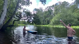 Guy Landing Directly From Rope Swing Onto A Skateboard In the Water To Grab A Beer  Its A Win