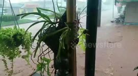 Flash floods wash motorcycle away in southern Thailand