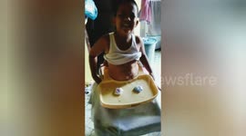 Funny moment boy trapped in his younger brother's baby walker