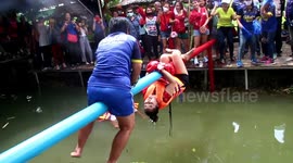 Thai locals hold 'boxing on pole' event to celebrate easing of Covid-19 restrictions