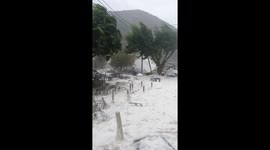 Amazing footage as Mediterranean 'hurricane' buries Greek village with sea foam causing widespread damage