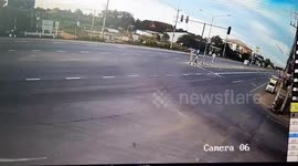 Motorcycle rider and passenger slam into ground after being clipped by car at junction