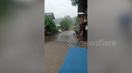 Rain falls on street while the other half stays dry in the Philippines