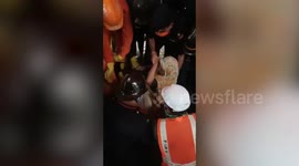 Moment woman rescued from collapsed building in western India