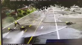 Chinese firefighters left soaked after colleague loses control of water hose during training