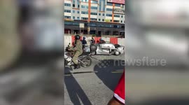 Driver survives unscathed after concrete barrier falls 60ft onto her car in Malaysia