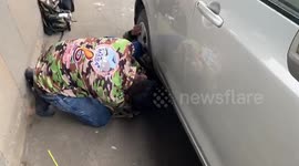 Huge 10-foot-long python removed from underneath vehicle in traffic on Indian highway