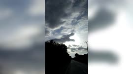 Bizarre dragon cloud appears to be eating the sun in Indonesia