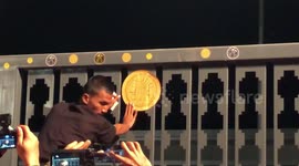 Protesters stick democracy plaques on gates of Thai parliament