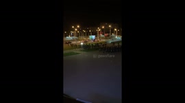 Internal troops throw stun grenades during a protest in Minsk