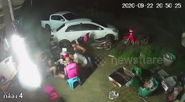 Chilling moment deadly snake creeps up on men having BBQ in Thailand