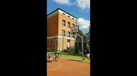 Funny Fail While A Guy Performing Basketball Trick Shot Using Bicycle Wheel