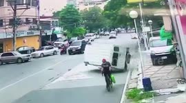 Lucky cyclist just inches away from being crushed by overturned minivan in the Philippines