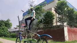 Riding high: Cycling enthusiast in India builds 'tallest bike' to raise awareness for the environment