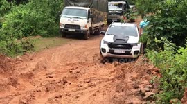 Vehicles struggle to reach remote school along muddy mountain road in Vietnam