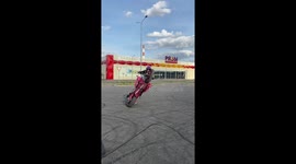 Russian stunt girl loses grip of bike while practicing new trick