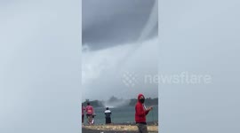 Terrified Indonesia locals watch massive waterspout forming off the coast