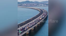 Lengthy traffic jams as thousands queue to leave city on first day of China's National Day holiday