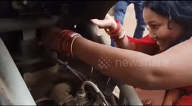 Wife of snake rescuer casually pulls rat snake from inside of scooter