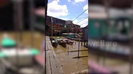 Huge cargo ship comes loose crushing boats and homes in Indonesia