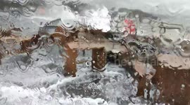 Watch as Storm Alex sends huge waves crashing over the Folkestone Harbour Arm in Kent, soaking the café and moving benches and chairs
