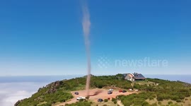 Hiker on Portugal's Maderia spots incredible dust devil on mountain