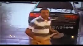 Man destroys a luxury car with an ax at a car dealership in Argentina