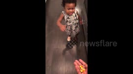 One-year-old girl creeped out by candy corn
