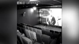 Cinema screen damaged in southern China after children repeatedly kick it