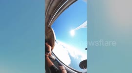 360 camera captures a skydivers incredible leap of faith that makes him look to be perched on top of the globe.