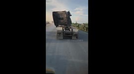 The deformed truck moves on the road