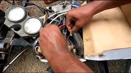 Watch - Young boy designs a car is his backyard using his father old bike motore engine