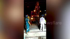 Workman rescued after falling into 12-metre deep hole during rainstorm in Bangkok